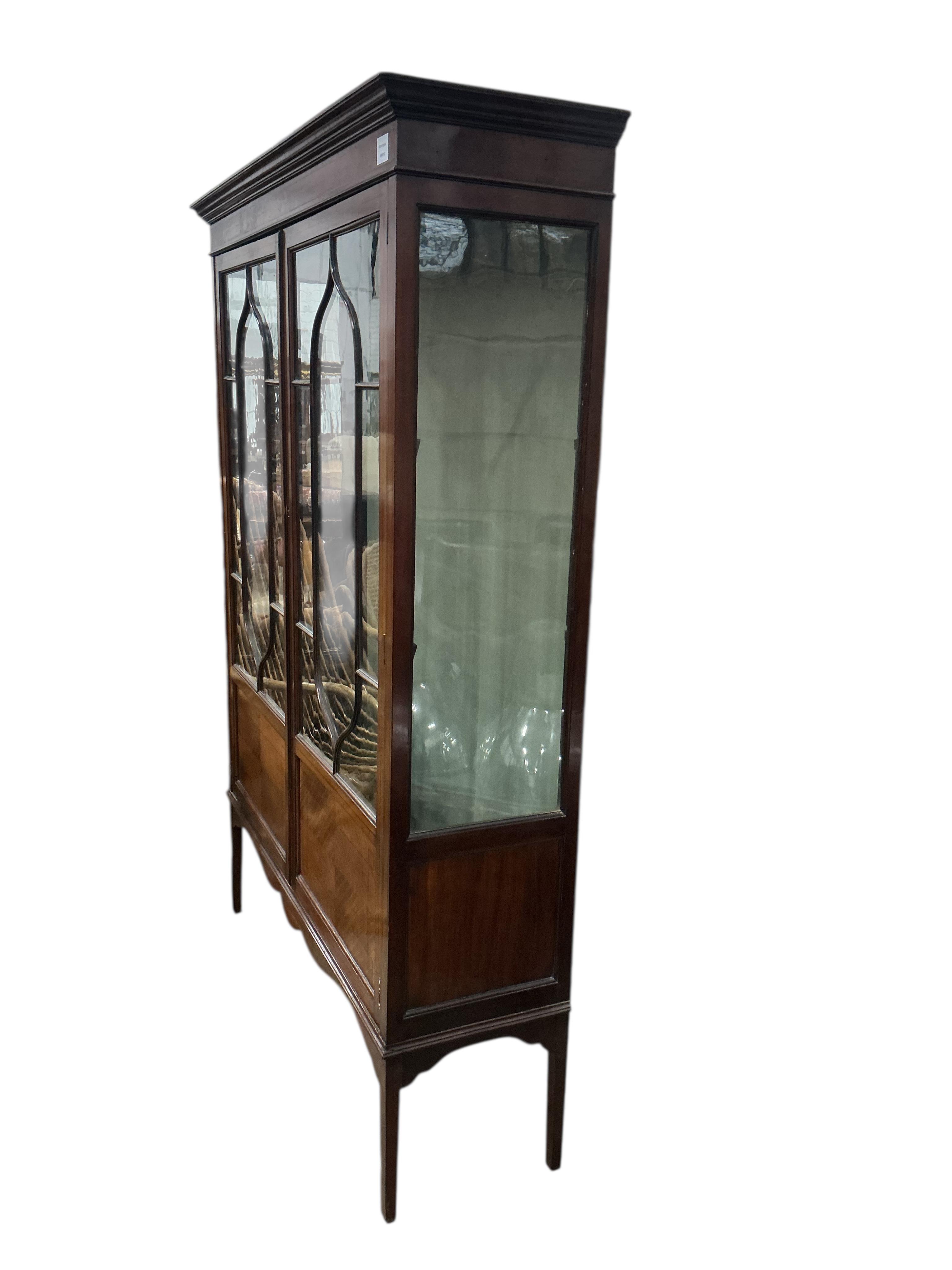 An Edwardian inlaid mahogany astragal glazed display cabinet, width 119cm, depth 35cm, height 165cm